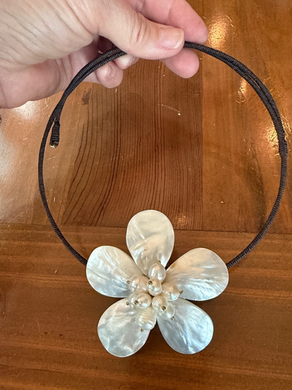 Handmade Pearl-she’ll White Flower Necklace on Brown Cord.  Adjustable